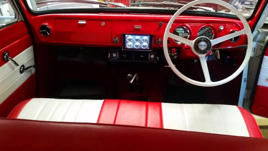 The electric Ford Cortina has a modern dash and nice interior.
