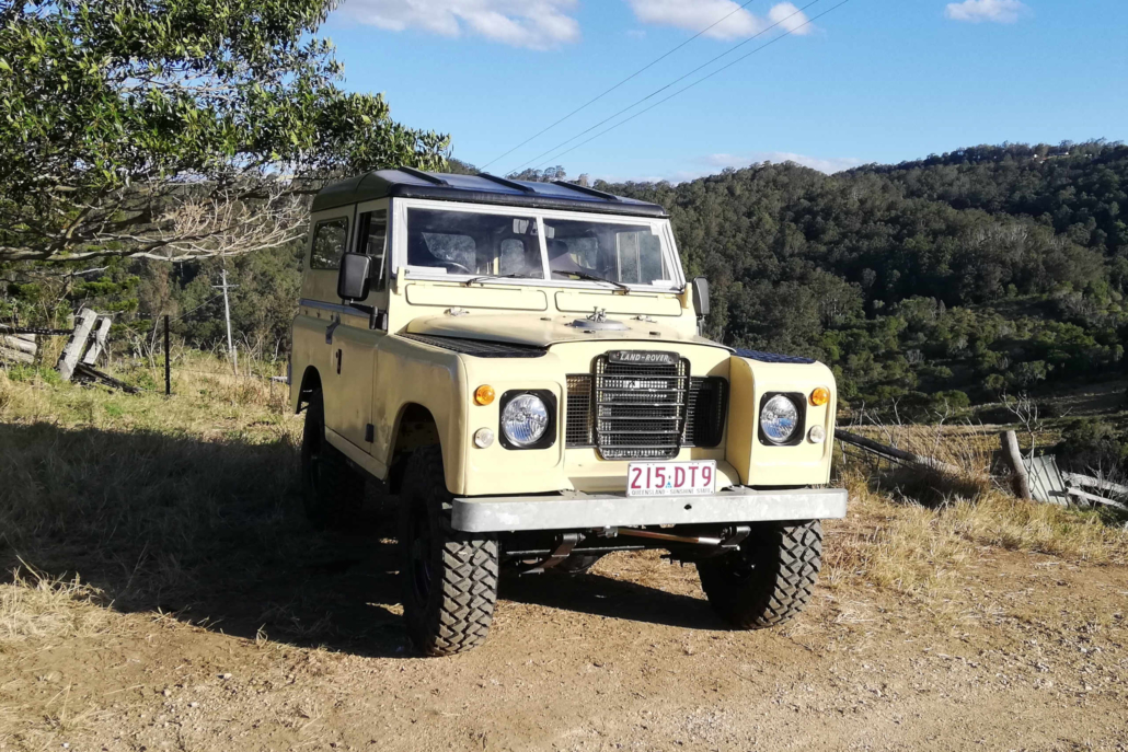 The 1973 Series 2 Land Rover EV at a scenic spot during a 4WD adventure.