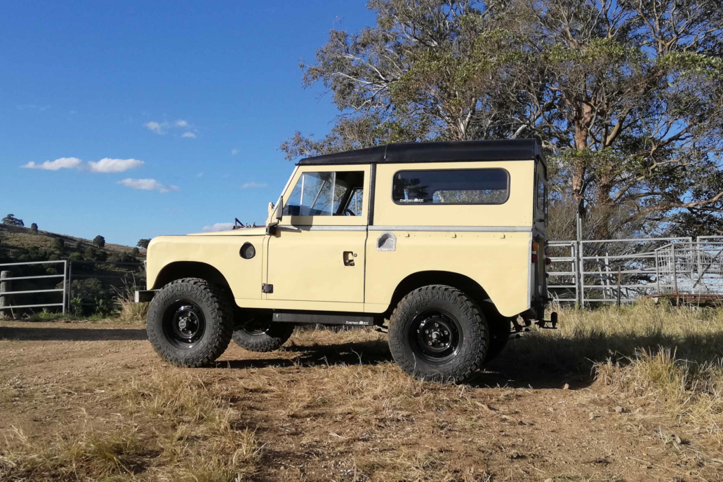 The 1973 Series 2 Land Rover EV at a scenic spot during a 4WD adventure.
