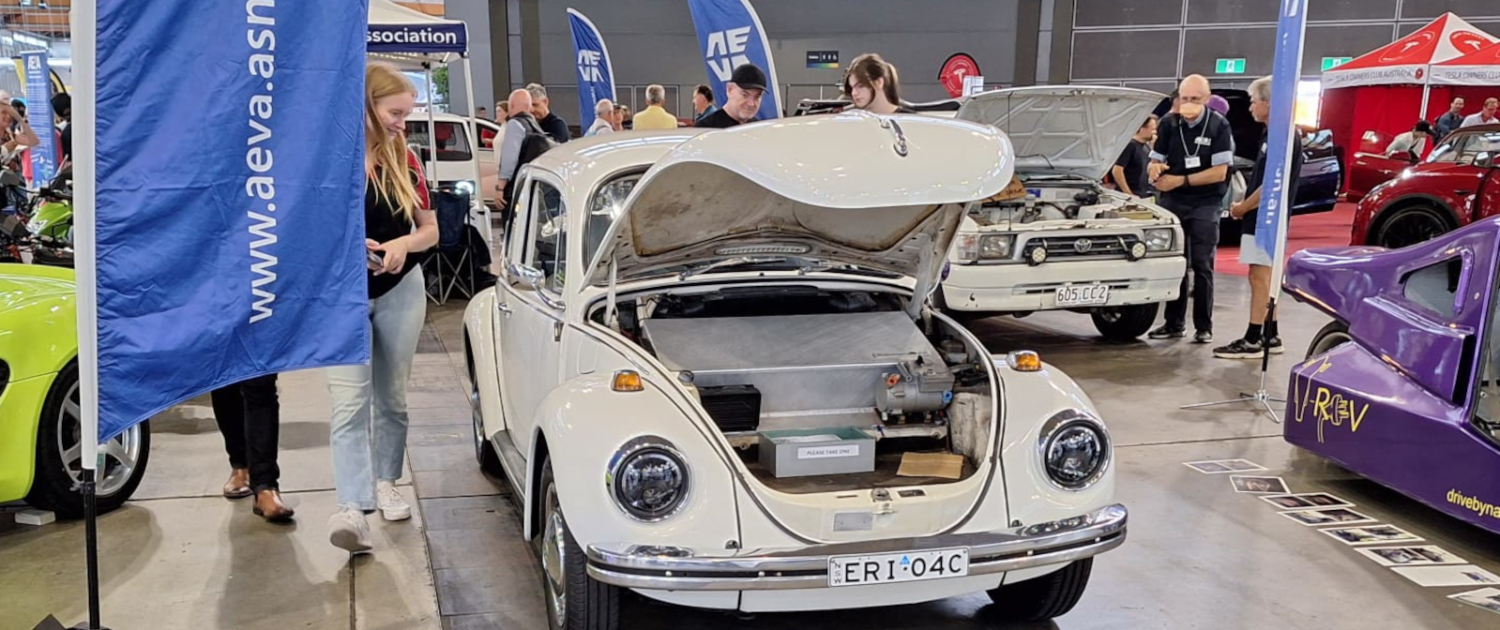 Front view of the 1971 Electric Super Beetle at the AEVA Sydney exhibition in 2024 with its battery box under the bonnet.