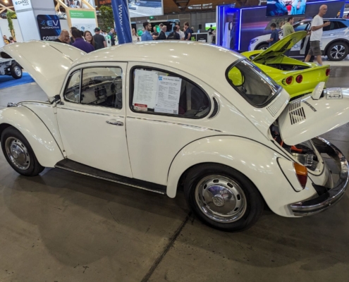 Side view of the 1971 Electric Super Beetle at the AEVA Sydney exhibition in 2024.